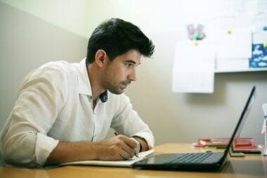 Middle-aged professional enhancing skills through online learning.